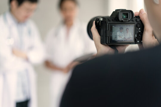 Photographer taking footage on the concept of doctors and nurses for sale on the website