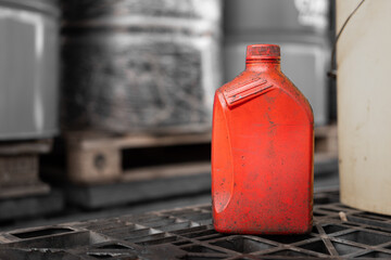 A red chemical bottle without safety information attached, it placed in warehouse chemical storage...