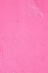 Closeup of saturated solid pink urban wall concrete texture. Modern pattern for wallpaper design. Creative modern urban city background for advertising mockups. Minimal monochrome style trendy color