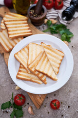 Toasted Bread Slices on wooden cutting board for breakfast