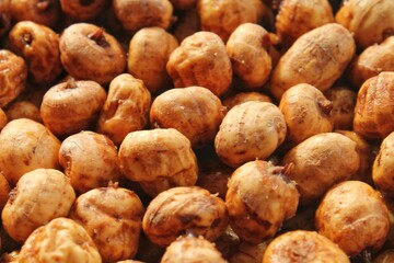 Fototapeta premium Close-up of chufa, tigernut, earth almond preparing for traditional typical tasty homemade cold fresh drink horchata from Valencia, Spain. Healthy organic food concept. Tiger nut for flour and milk