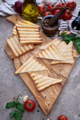 Toasted Bread Slices on wooden cutting board for breakfast