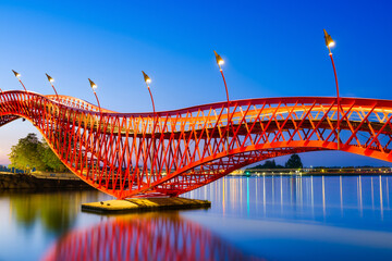 A bridge in the city at night. The bridge on the blue sky background during the blue hour....
