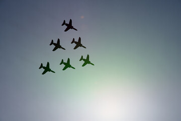 Acrobatic fighter silhouette in flight