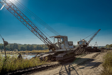 Excavator extracts stone in a quarry.