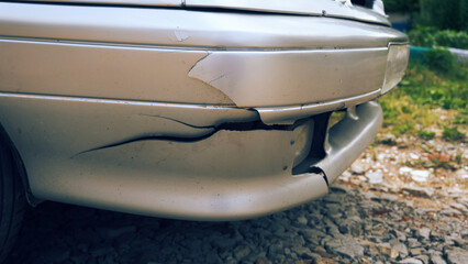 A broken bumper in the car, an accident, a breakdown and a cracked bumper. Plastic element of the...