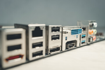 The back of a modern motherboard with a large set of ports for connecting peripheral equipment for...
