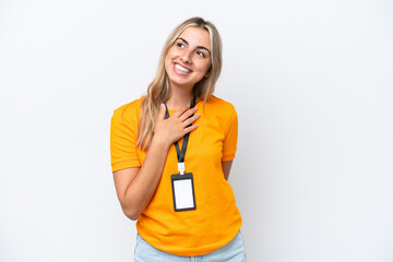 Young caucasian woman with ID card isolated on white background looking up while smiling