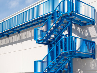 blue fire escape in an industrial building