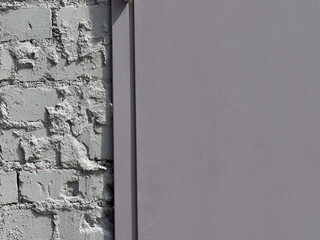 brick wall painted with gray paint. Texture of dark brick wall