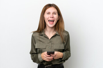 Young English woman isolated on white background surprised and sending a message