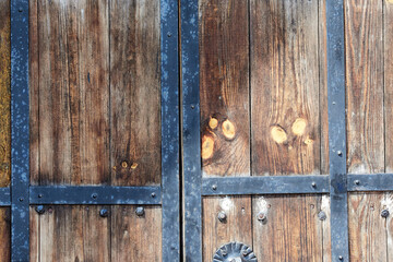 Old gate with metal sheathing