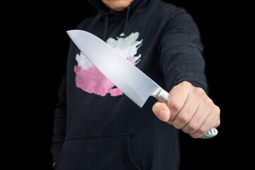 包丁を持つ人物