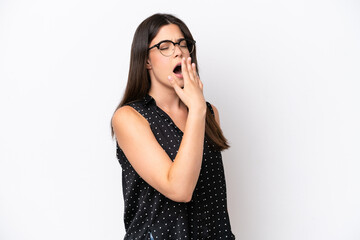 Young Brazilian woman isolated on white background yawning and covering wide open mouth with hand