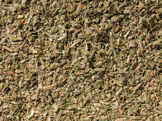 Dried oregano condiment background, used as a spice in cooking. Organic Dried oregano, overhead view. texture of dried oregano. Top view, Flat lay. Organic food, healthy lifestyle. Food flavoring