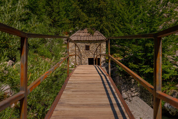 Bridge to popular tourist attraction in Valbona valley, Albania, a Mulliri i Vjeter old mill house....