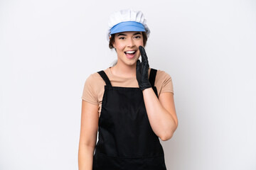 Fishmonger brazilian woman wearing an apron isolated on white background shouting with mouth wide open