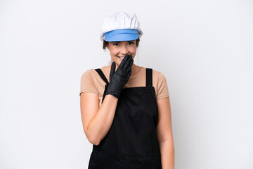 Fishmonger brazilian woman wearing an apron isolated on white background happy and smiling covering mouth with hand