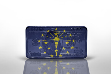 flag of indiana state on the dollar money banknote on the white background .