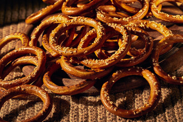 Lots of bagels sprinkled with sesame seeds. Close-up, patern photo.