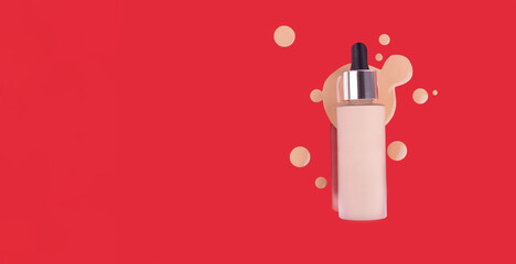 Bottle of makeup foundation and samples on red background. Liquid foundation cream unbranded bottle. BB cream for professional make-up, eyedropper for applying. Mock up concept
