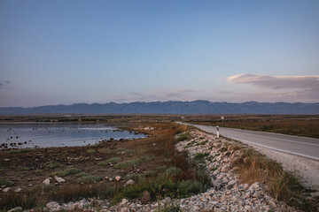 Road and sea bay on Island Pag in Croatia during the sunset