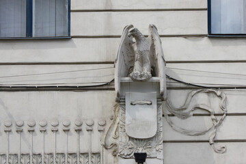 Sculpture of an eagle on the facade of Museum of Fine Arts in Chernivtsi, Ukraine - obrazy, fototapety, plakaty