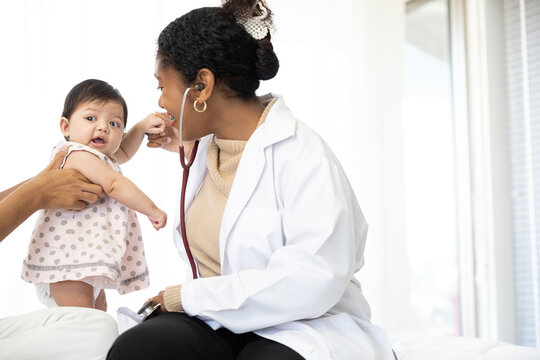 mother and baby visit to the doctor using stethoscope checking heart beat