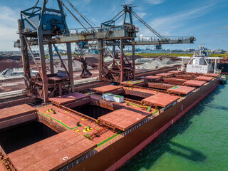 Cranes Unloading Cargo from a Bulk Carrier Ship at Port