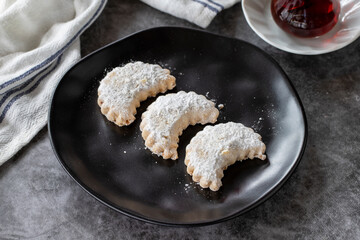 Sweet almond cookies. Delicious snack cookies on dark background. Bakery products. side view. Local name kavala cookies. Close-up.