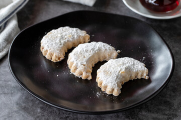 Sweet almond cookies. Delicious snack cookies on dark background. Bakery products. side view. Local name kavala cookies. Close-up.