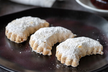 Sweet almond cookies. Delicious snack cookies on dark background. Bakery products. side view. Local name kavala cookies. Close-up.