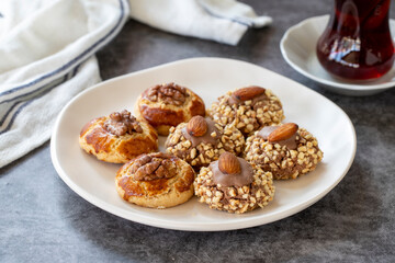 Almond and walnut cookies. Assortment of sweet cookies on dark background. Bakery products. side view. Close-up.