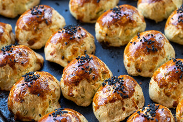 Sesame cookies. Fresh salt cookies on dark background. Bakery products. side view. Close-up.