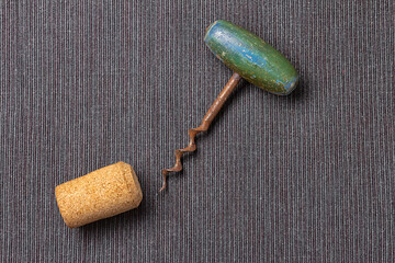 Old vintage bottle screw on grey tablecloth