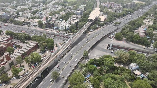 An Aerial Shot of Delhi Metro and Traffic movement at Moolchand Flyover in New Delhi,India