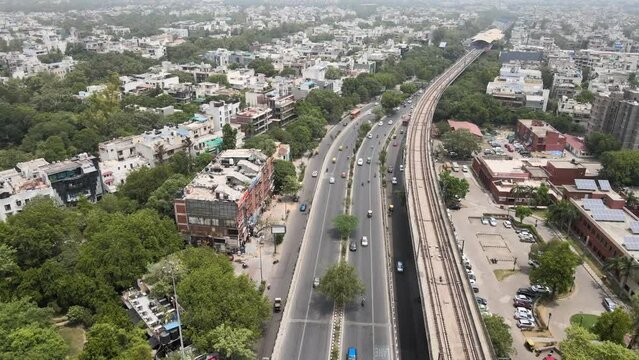 An Aerial Shot of Delhi Metro and Traffic movement at Moolchand Flyover in New Delhi,India