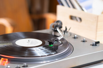 The Vinyl record player or turntable or vinyl record player on the table