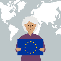 A grandmother holds the flag of the European Union in his hands against the background of a world map.