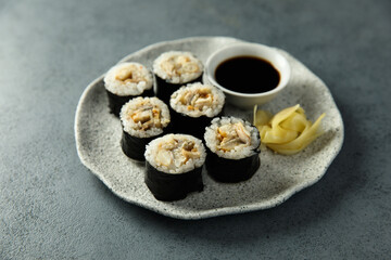 Eel sushi with soy sauce and ginger