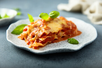 Traditional homemade lasagna with fresh basil	