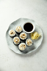 Eel sushi with soy sauce and ginger