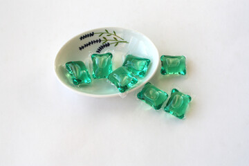 Gel capsules with laundry detergent .
