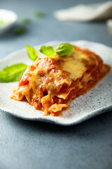 Traditional homemade lasagna with fresh basil	