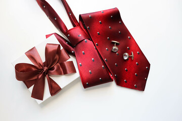 set of men's accessories. red men's tie, cufflinks and gift box