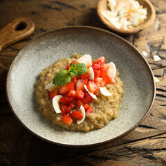 Healthy quinoa porridge with fresh strawberry