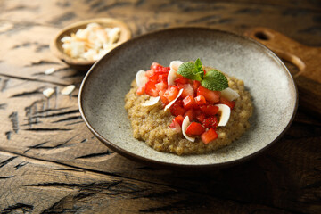 Healthy quinoa porridge with fresh strawberry