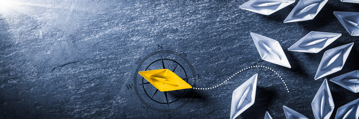 Yellow Paper Boat With Compass Leaving Group And Changing Direction - Entrepreneur/Business Opportunity