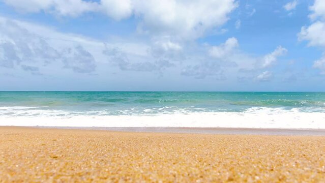 Golden sand blue sky white clouds. Ocean wave sea beach panorama.