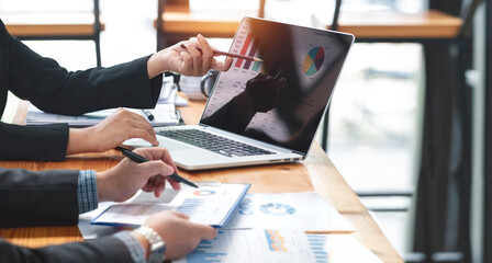 Businessman advisor, two business people talking, planning analyze investment and marketing on tablet in office.